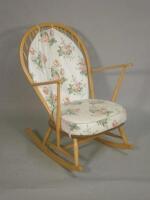 An Ercol pale elm and beech rocking chair