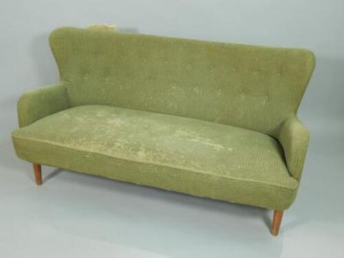 *A 1950's three seat sofa and matching armchair by Ernest Race