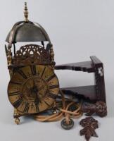 A reproduction brass lantern clock