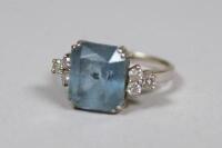 An 18ct gold aquamarine and diamond ring