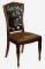 A pair of Art Nouveau mahogany dining chairs with foliate pierced backs and swell legs