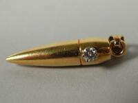 A bullet shaped pendant