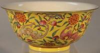 A Chinese porcelain yellow ground circular bowl