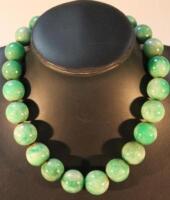 A Chinese green jade necklace