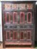 A large Chinese stained and painted pine marriage cabinet