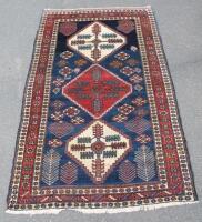 A Bahktiar rug of rectangular form