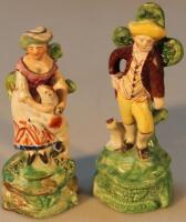 A pair of early 19thC Staffordshire creamware figures