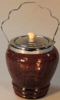 An Art Deco period aubergine crackle glass biscuit barrel