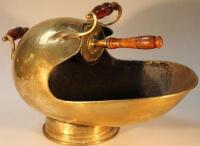 A late 19thC/early 20thC brass coal helmet and shovel