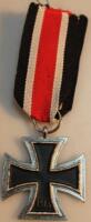 A reproduction Iron Cross with ribbon.