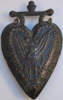 A most unusual double sided heart shaped token