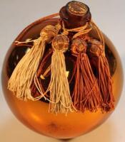 An early 20thC orange glass witch ball