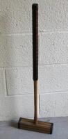 An early 20thC light wood croquet mallet