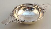 A George VI silver tea strainer