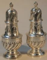 A fine pair of George III silver sugar casters