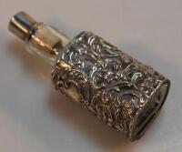 An Edwardian silver and glass filigere scent bottle