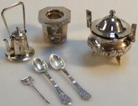 A Chinese white metal three piece cruet set