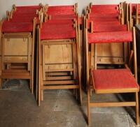 A quantity of beech framed stacking chairs