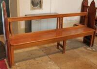 A 19thC and later pitch pine church pew. 218cm wide.