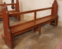 A 19thC and later pitch pine church pew