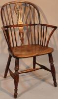 An 19thC yew and elm low back Windsor chair