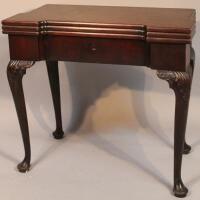 A George III mahogany double fold over tea and games table