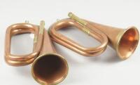 A 'Premier' copper and brass bugle and another similar bugle