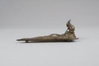 After A. Carri. A bronze pen holder desk stand modelled in the form of a hare seated on a knoll