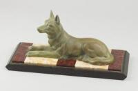 A 1930s French animalier bronze sculpture of a recumbent wolf