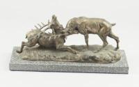 A French animalier sculpture of two stags locking horns after T. Cartier