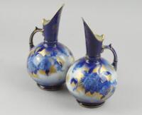 A pair of Keeling & Co (late Mayers) blue ewers