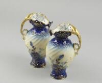 A pair of early 20thC Austrian porcelain ewers