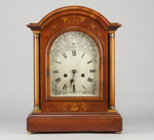 An Edwardian oak bracket clock