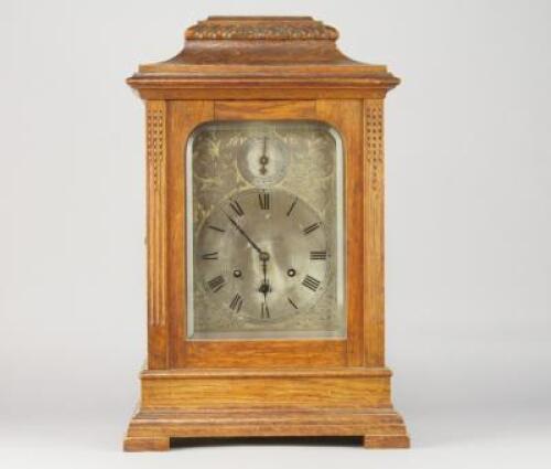 An Edwardian inlaid mahogany bracket clock