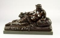 An early 20thC bronze of a reclining nude figure of Cleopatra