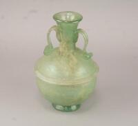 A Romanesque green glass amphora