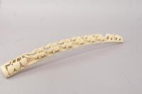 A carved ivory tusk