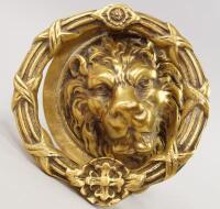 A heavy cast brass door knocker