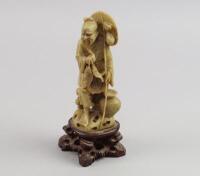 A Japanese carved soapstone figure