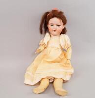 An early 20thC Armand Marseille bisque headed doll