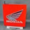 A Honda illuminating trade sign