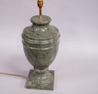 A variegated reconstituted marble urn shaped table lamp