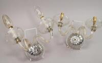 A pair of mid 20thC glass twin wall sconces