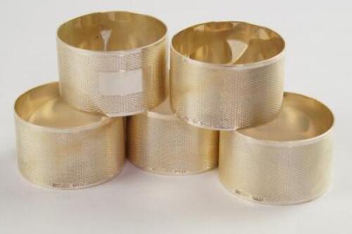 Five silver napkin rings