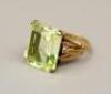 A large emerald cut stone ring