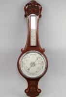 A 1940's oak aneroid barometer.