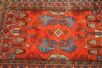 An early 20thC Middle Eastern bordered rug