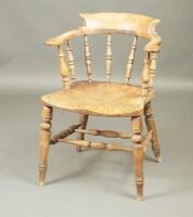 A Victorian ash and elm smokers bow chair.