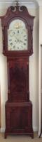 An early 19thC flamed mahogany longcase clock