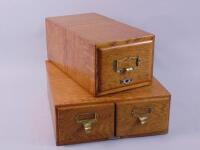 A set of three early 20thC oak filing boxes